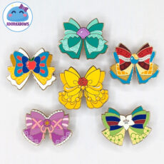 6 bow shaped enamel pins with inspiration from various princesses