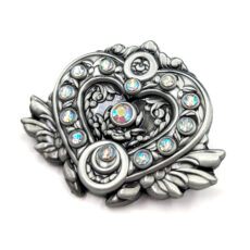 3d pin with gemstones it's heart shaped with wings and the texture is floral