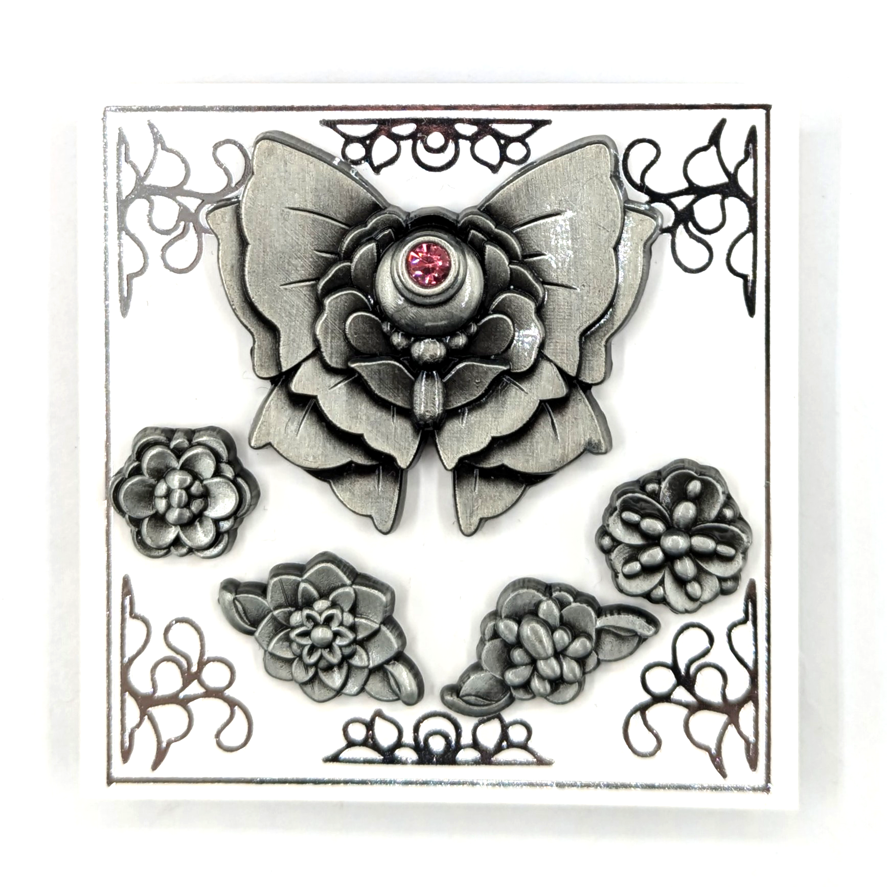 Set of 5 mini pins, one a bow and the other 4 flowers in 3D metal