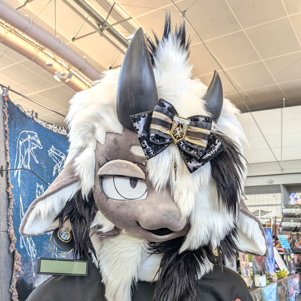 a fursuiter wearing one of my hair bows on their head