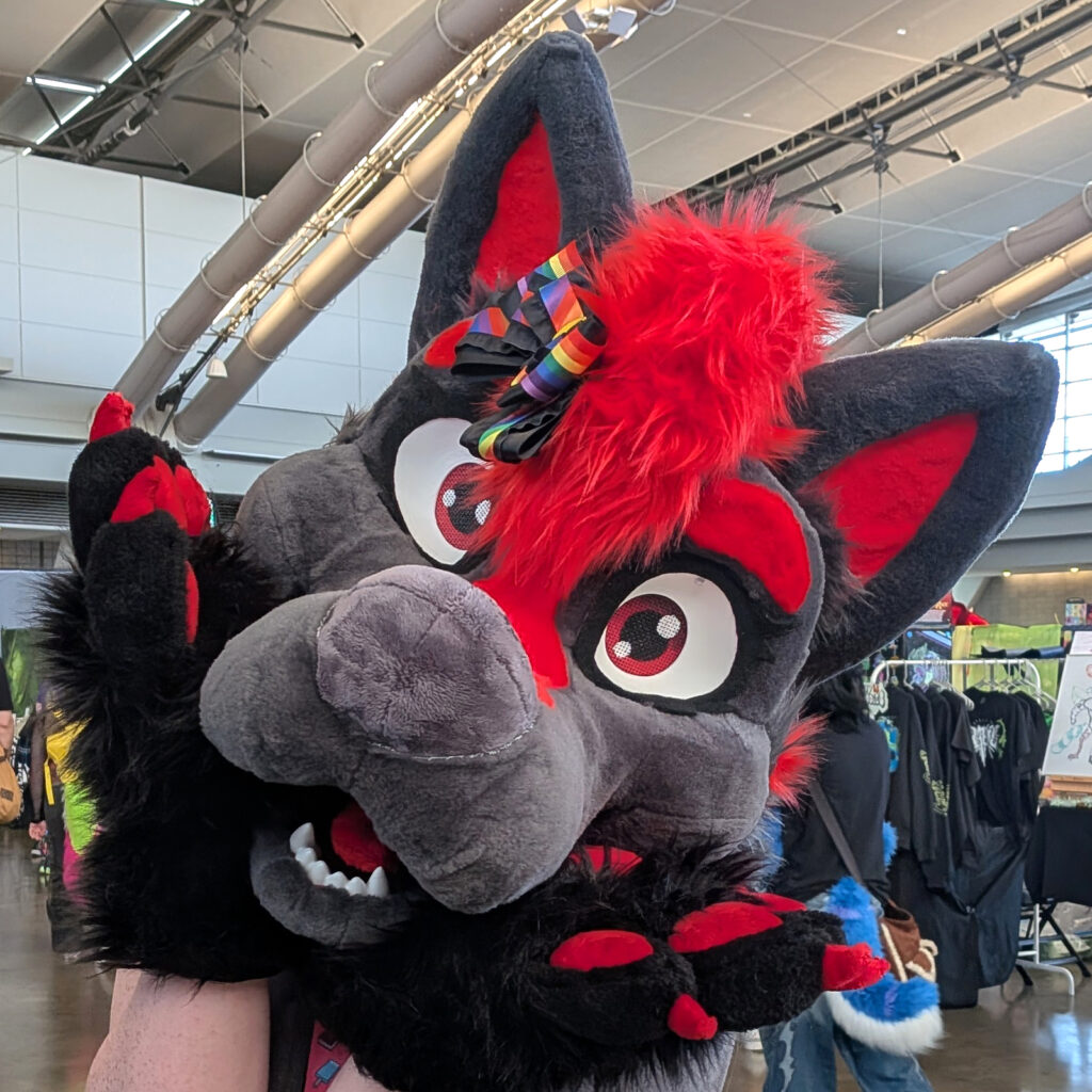 a fursuiter wearing one of my hair bows on their head