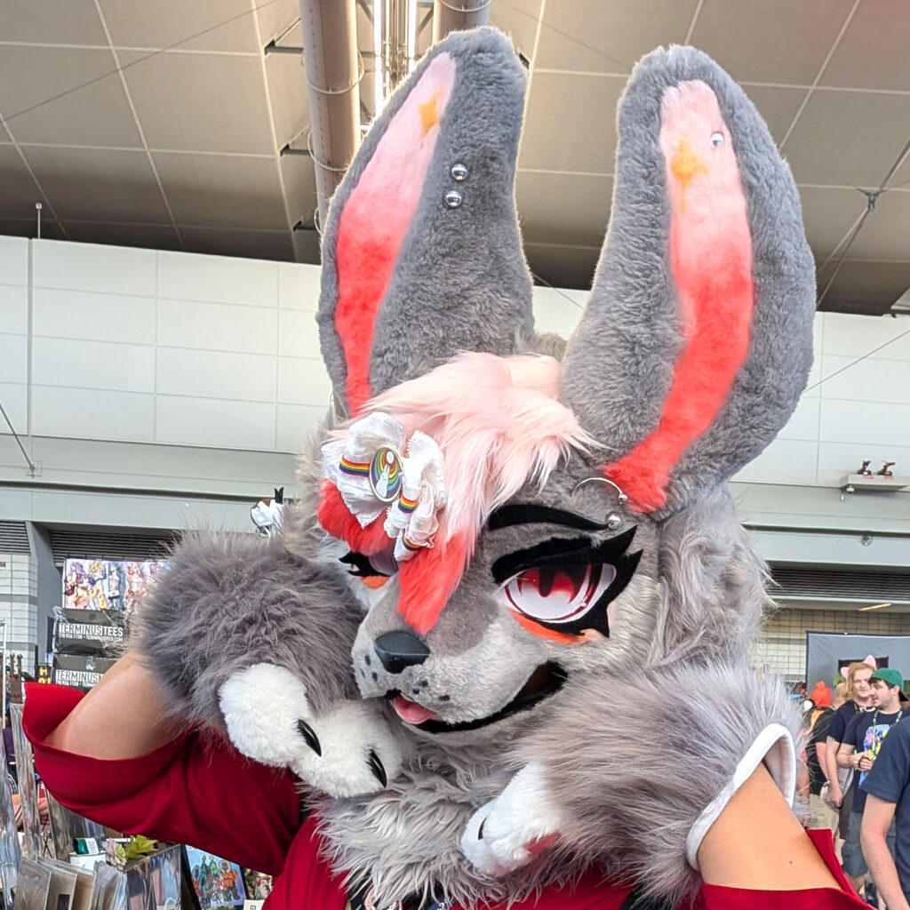 a fursuiter wearing one of my hair bows on their head