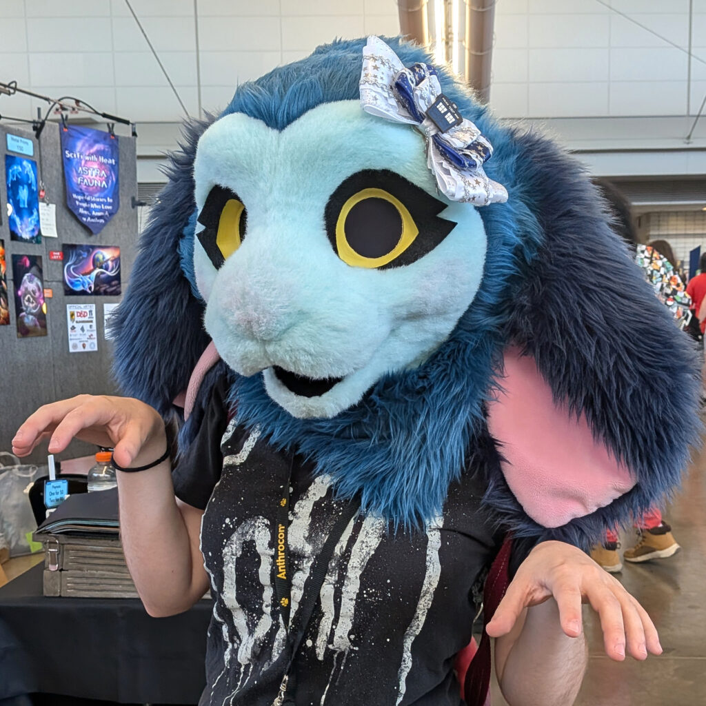 a fursuiter wearing one of my hair bows on their head