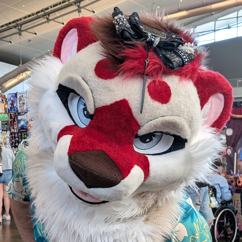 a fursuiter wearing one of my hair bows on their head